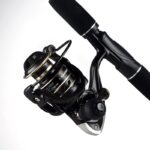 Reel black Rain carrete metalico, manija de fuerza.