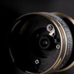 Reel black Rain carrete metalico, manija de fuerza.